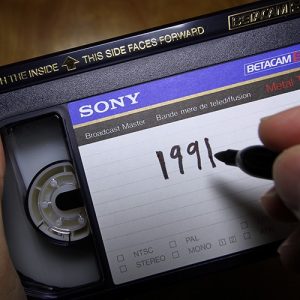 Labeling a Betamax videotape with a marker